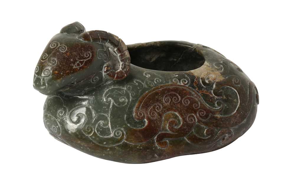 Lot 306 - A CHINESE GREEN JADE 'RAM' WASHER