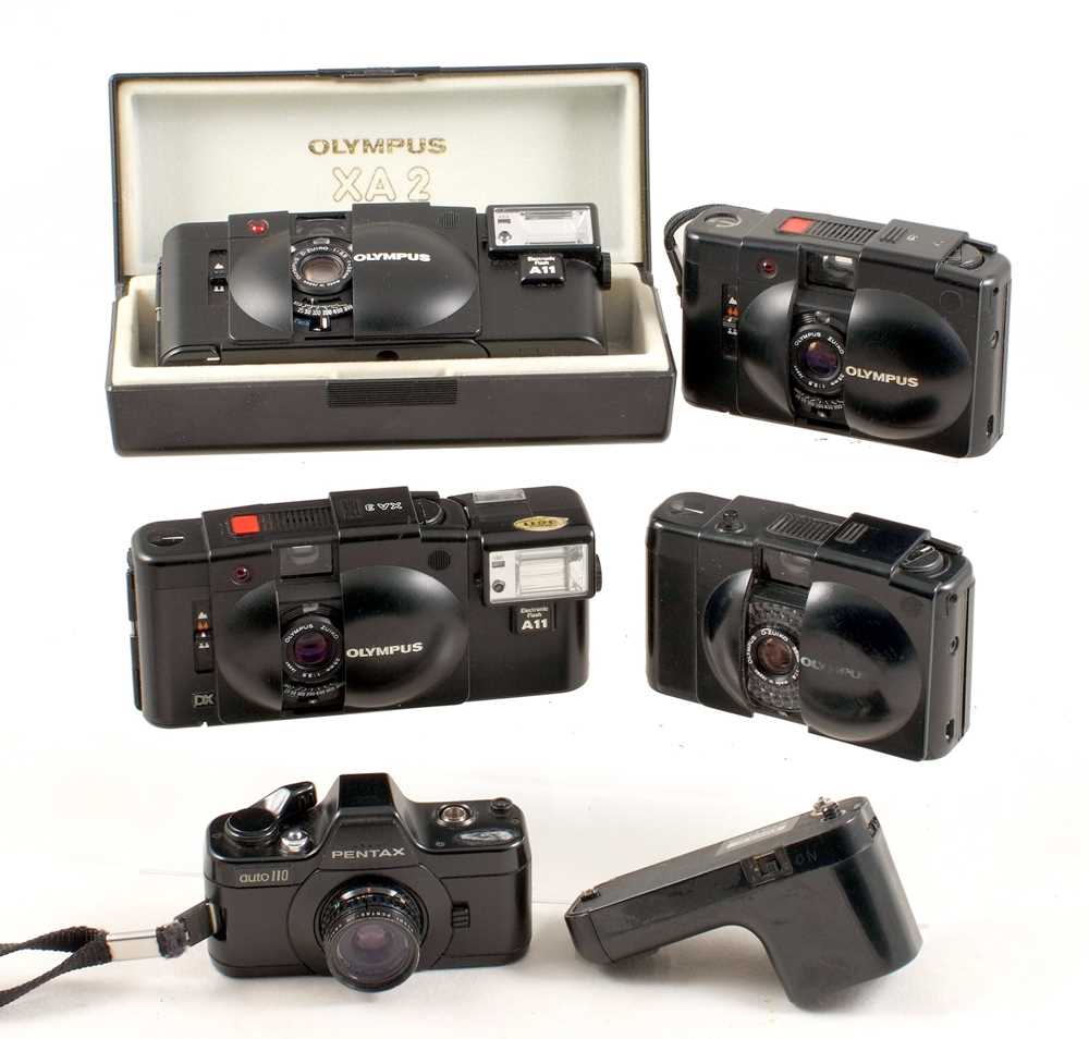 Lot 125 - Olympus XA2 & XA3 Compact Cameras & a Pentax 110 SLR.