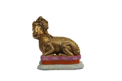 Lot 830 - A CHINESE GILT-BRONZE MODEL OF A QILIN.