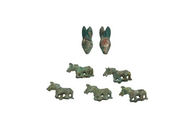 Lot 17 - A PAIR OF CHINESE BRONZE 'RABBIT' HAT ORNAMENTS AND FIVE SMALL CHINESE BRONZE 'HORSE' ORNAMENTS.