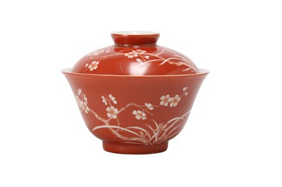 Lot 954 - A CHINESE CORAL-GROUND 'PRUNUS' BOWL AND COVER.