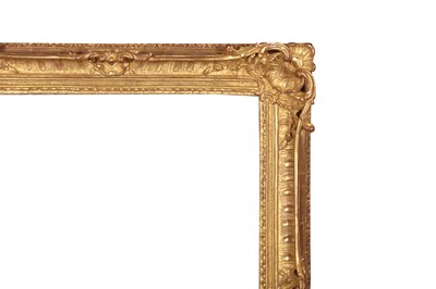 Lot 197 - A LOUIS XV STYLE CARVED, PIERCED, SWEPT AND GILDED FRAME