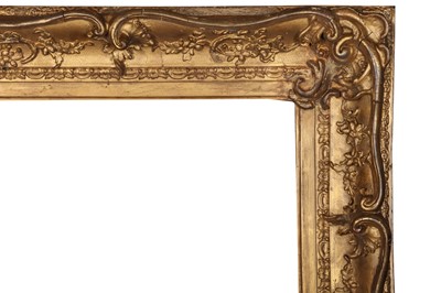 Lot 187 - A LOUIS XV STYLE SWEPT AND GILDED COMPOSITION FRAME