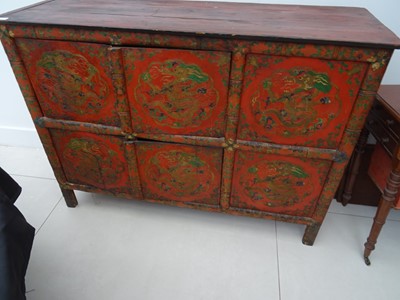 Lot 108 - A TIBETAN RED LACQUERED SIDE CABINET