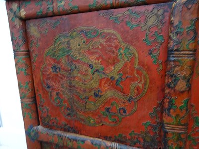 Lot 108 - A TIBETAN RED LACQUERED SIDE CABINET