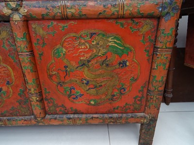 Lot 108 - A TIBETAN RED LACQUERED SIDE CABINET