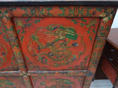Lot 108 - A TIBETAN RED LACQUERED SIDE CABINET