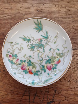 Lot 426 - A PAIR OF CHINESE FAMILLE ROSE 'BITTER MELLON' SAUCERS.