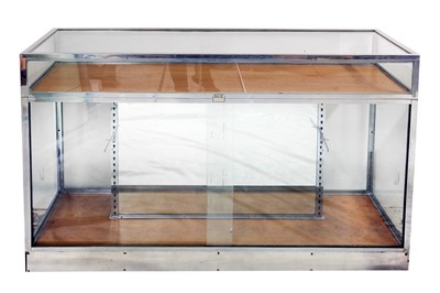 Lot 143 - A LARGE FRENCHCHROMED BRASS AND WOOD RECTANGULAR  SHOP DISPLAY COUNTER, 20TH CENTURY by  BASIL