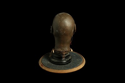 Lot 43 - A MODEL OF A TRIBAL ELDERS' HEAD A NEW GUINEA  TRIBAL HEAD UNDER A LARGE 19TH CENTURY GLASS DOME