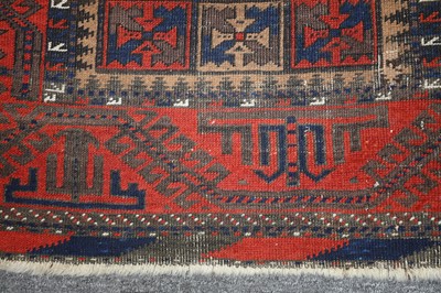 Lot 16 - AN ANTIQUE BALOUCH RUG, NORTH-EAST PERSIA
