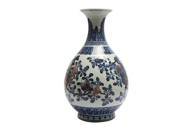 Lot 589 - A CHINESE BLUE AND WHITE AND UNDERGLAZE-RED 'FRUIT' VASE, YUHUCHUNPING.