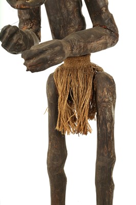 Lot 40 - A CARVED WOODEN TRIBAL FIGURE