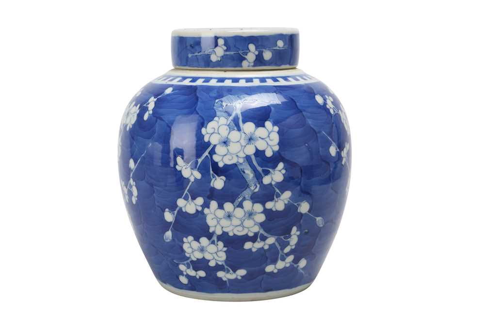 Lot 455 - A CHINESE BLUE AND WHITE 'PRUNUS' JAR AND COVER.