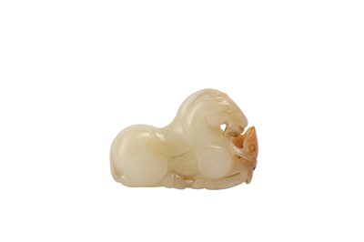 Lot 657 - A CHINESE PALE CELADON JADE MODEL OF A HORSE.