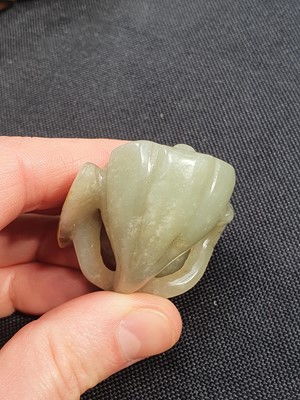 Lot 513 - A CHINESE CELADON JADE 'LOTUS PODS' CARVING.