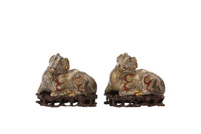 Lot 25 - A PAIR OF CHINESE CLOISONNÉ ENAMEL AND GILT BRONZE ‘RAM’ PAPER WEIGHTS.