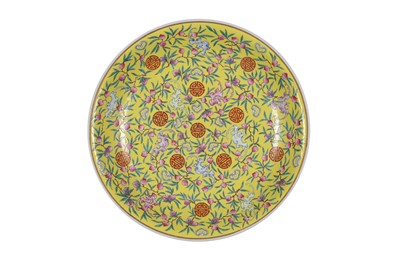 Lot 280 - A CHINESE FAMILLE ROSE YELLOW-GROUND 'BATS AND PEACHES' CHARGER.