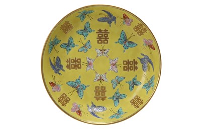 Lot 673 - A SMALL CHINESE FAMILLE ROSE YELLOW-GROUND 'MARRIAGE' DISH.