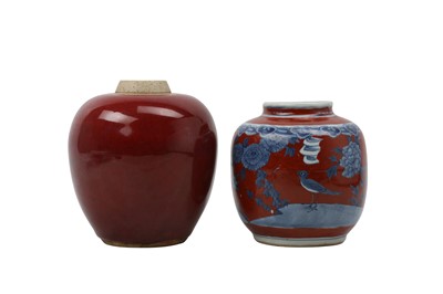 Lot 939 - A CHINESE BLUE AND WHITE AND A RED-GLAZED JAR.