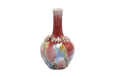 Lot 940 - A CHINESE FLAMBE-GLAZED 'SQUIRREL AND VINE' BOTTLE VASE.