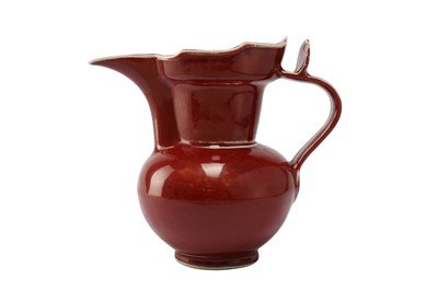 Lot 919 - A CHINESE RED-GLAZED 'MONK CUP' EWER.