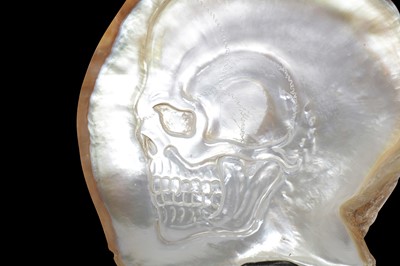 Lot 114 - HAND-CARVED BLACK-LIP OYSTER (PINCTADA MARGARITIFERA) MOTHER OF PEARL SHELL WITH SKULL