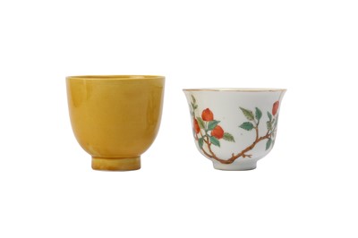 Lot 848 - A CHINESE YELLOW-GLAZED CUP AND A FAMILLE ROSE ‘PEACHES’ CUP.