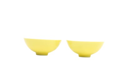 Lot 915 - A PAIR OF CHINESE YELLOW-GLAZED CUPS.