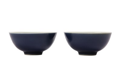 Lot 949 - A PAIR OF CHINESE BLUE-GLAZED CUPS.