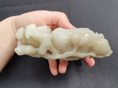 Lot 575 - A CHINESE PALE CELADON JADE 'PEACH AND LINGZHI' WASHER.