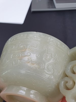 Lot 571 - A CHINESE PALE CELADON JADE ARCHAISTIC CUP.