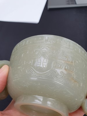 Lot 571 - A CHINESE PALE CELADON JADE ARCHAISTIC CUP.