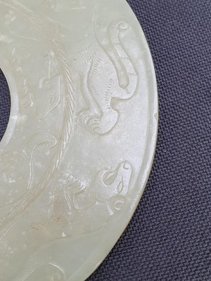 Lot 23 - A CHINESE YELLOW JADE ARCHAISTIC DISC, BI.