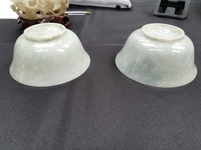Lot 573 - A PAIR OF CHINESE APPLE-GREEN JADEITE BOWLS.