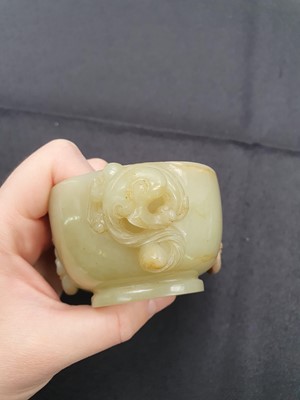 Lot 261 - A CHINESE YELLOW JADE WASHER.