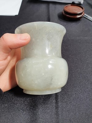 Lot 463 - A CHINESE GREY JADE SPITTOON.