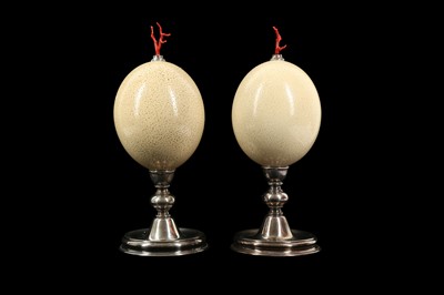 Lot 322 - A PAIR OF MID-CENTURY OSTRICH EGGS MOUNTED WITH MEDITERRANEAN CORAL