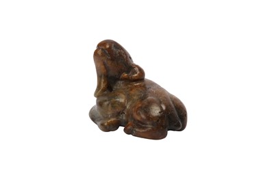 Lot 658 - A CHINESE CELADON JADE MODEL OF A RAM.