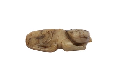 Lot 623 - A CHINESE CHICKEN JADE 'QILIN' CARVING.