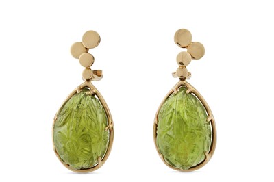 Lot 59 - A pair of carved peridot earclips