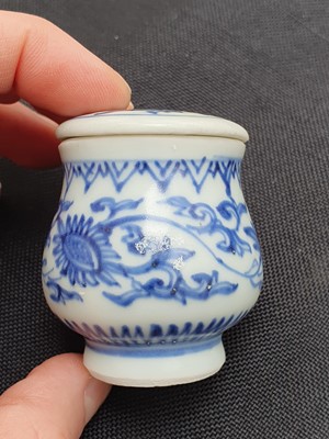Lot 87 - TWO CHINESE BLUE AND WHITE JARLETS WITH COVERS.