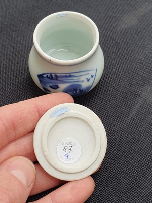 Lot 87 - TWO CHINESE BLUE AND WHITE JARLETS WITH COVERS.