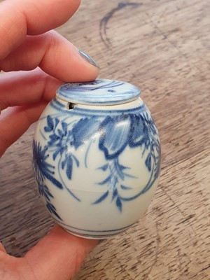 Lot 91 - TWO CHINESE BLUE AND WHITE JARLETS WITH COVERS INCLUDING A RARE UPSIDE-DOWN-DECORATED JAR.
