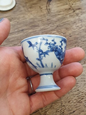 Lot 90 - A PAIR OF SMALL CHINESE BLUE AND WHITE ‘THREE FRIENDS’ STEM CUPS.