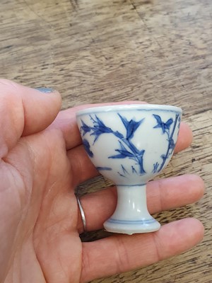 Lot 90 - A PAIR OF SMALL CHINESE BLUE AND WHITE ‘THREE FRIENDS’ STEM CUPS.