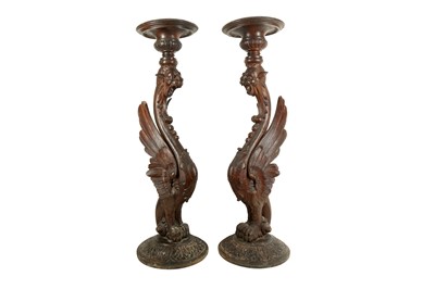 Lot 320 - A LARGE PAIR OF 19TH CENTURY ITALIAN CARVED WOOD GRIFFIN TORCHERE STANDS