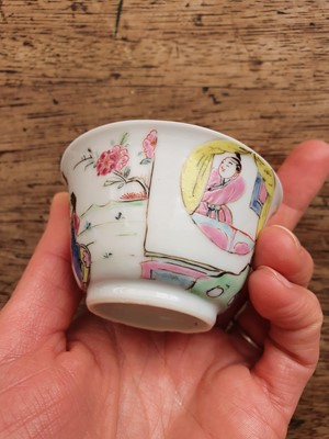 Lot 72 - A CHINESE FAMILLE ROSE 'LOVERS' TEA CUP AND SAUCER.