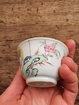 Lot 72 - A CHINESE FAMILLE ROSE 'LOVERS' TEA CUP AND SAUCER.