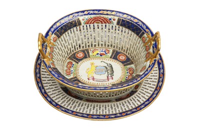 Lot 82 - A CHINESE FAMILLE ROSE ARMORIAL RETICULATED BASKET AND STAND.